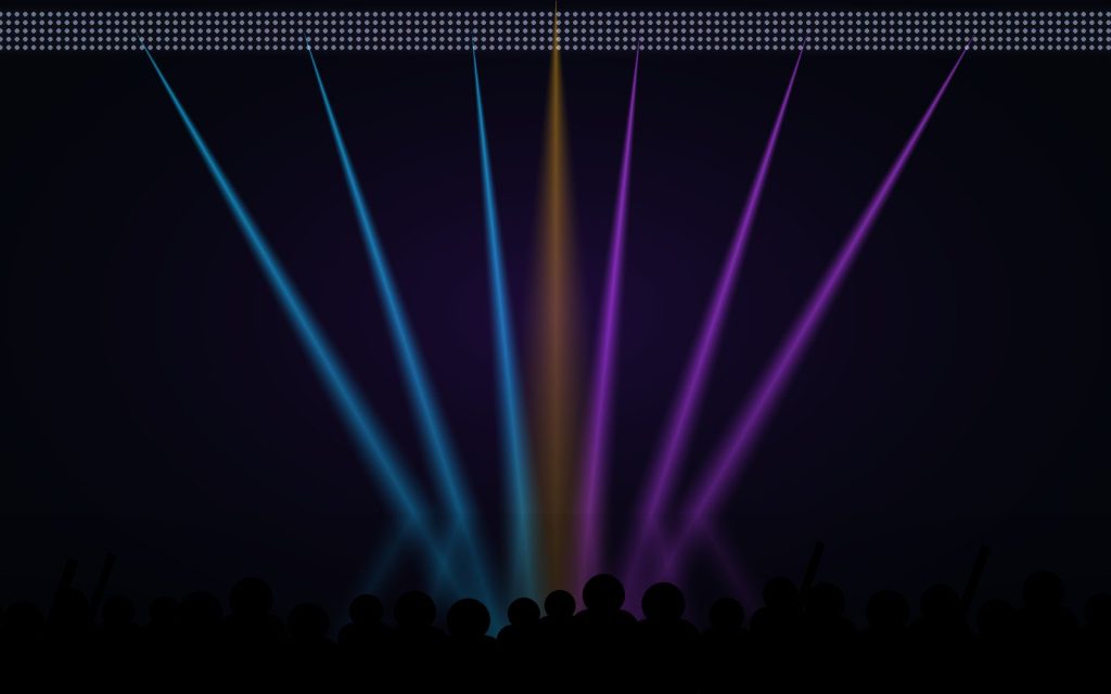 Stage lighting beams at a concert